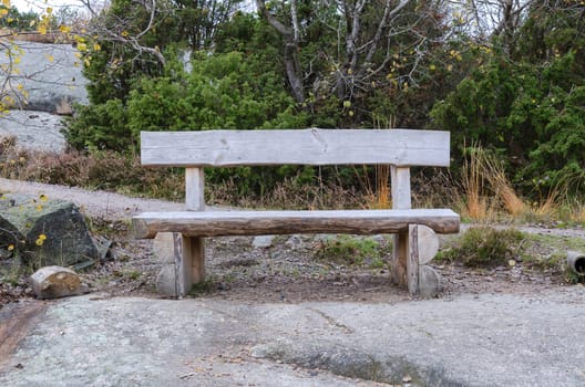 old bench made of rustic wood placed in the nature to rest your body