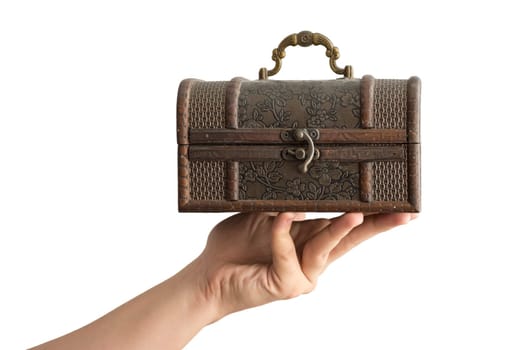 A Hand Holding a Traditional Olden Closed Box isolated on white background