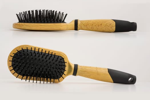 Front and left view of hair brushes isolated on white background.