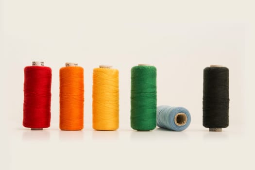 Multicolor Sewing Threads, Bobbins, Isolated on White Background.