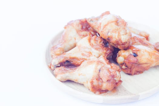 Grilled chicken wings isolated on white background, stock photo