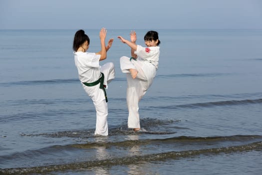 KAGAWA, JAPAN - Jan 3: Japanese karate girls training of karate in midwinter of a new year at Ichinomiya Beach, January 3, 2016, Kagawa, Japan