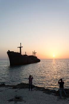 Taking Photos By Cell phones From Greek Ship Wreckage in Kish Island at Sunset