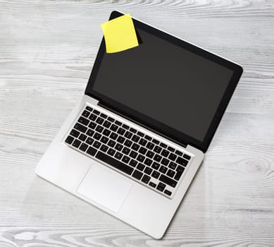 View of a Lapotop in high definition on a wood background