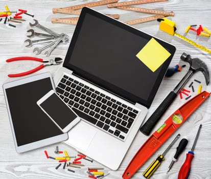 View of a Wood handyman's desk in high definition with laptop, tablet and mobile