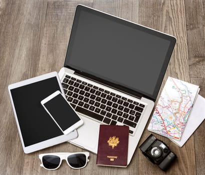 View of a Wood tourist's desk in high definition with laptop, tablet and mobile