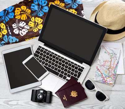 View of a Wood tourist's desk in high definition with laptop, tablet and mobile