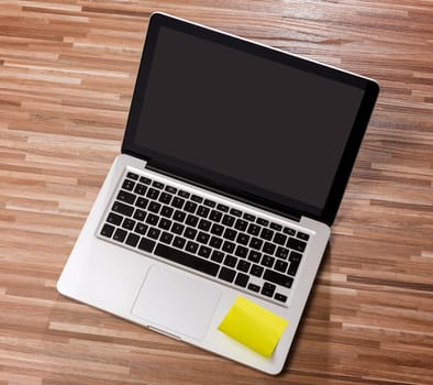 View of a Laptop in high definition on a wood background