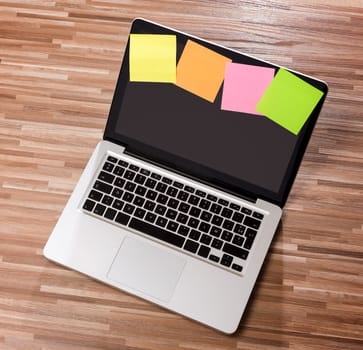 View of a Laptop in high definition on a wood background