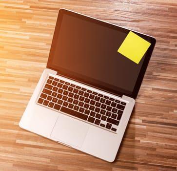 View of a Laptop in high definition on a wood background
