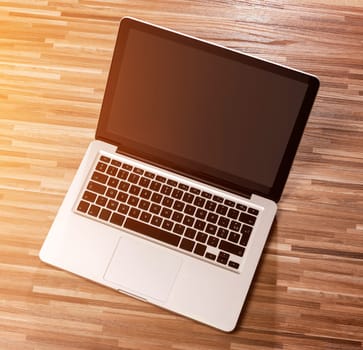 View of a Laptop in high definition on a wood background