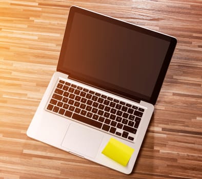 View of a Laptop in high definition on a wood background