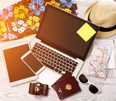 View of a Wood tourist's desk in high definition with laptop, tablet and mobile