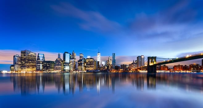 New York City - beautiful sunrise over manhattan with manhattan and brooklyn bridge USA