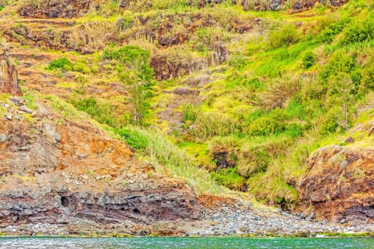 Colorful rocky cliff coast of Madeira between Jardim do Mar and Calheta
