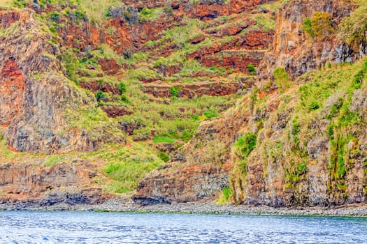 Colorful rocky cliff coast of Madeira between Jardim do Mar and Calheta