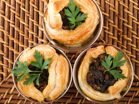 Puff pastry stuffed with ground beef, onion, cumin and other seasonings