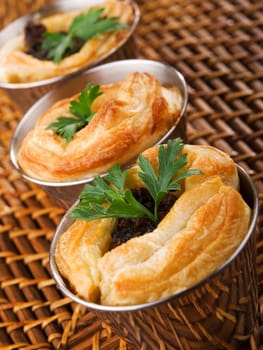 Puff pastry stuffed with ground beef, onion, cumin and other seasonings