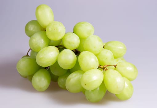 Green Grapes Close Up on grey background.