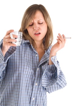 Young woman drinking coffee and smoking isolated on white