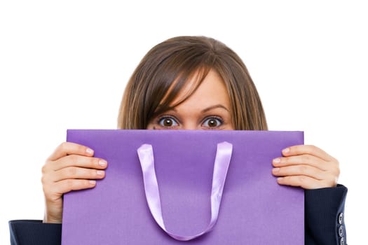 Businesswoman opening purple present with surprise isolated on white background