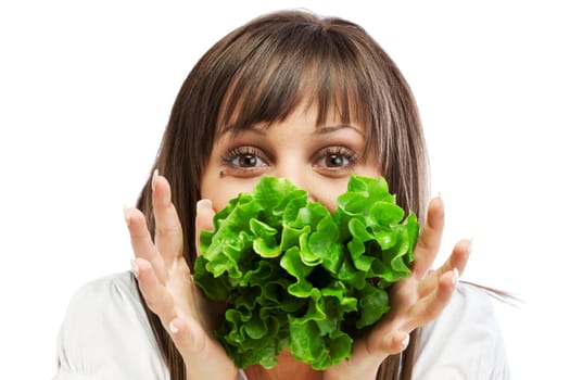Young woman eating fresh salad isolated on white