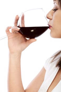 Young woman drinking red wine isolated on white background