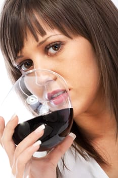 Young woman drinking red wine isolated on white background