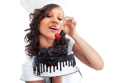 Young chef woman holding chocolate cake, isolated on white