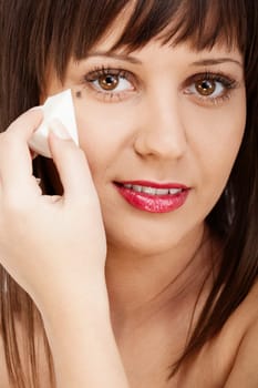 Beauty shot of woman applying make-up