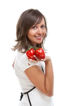 Young woman holding fresh tomatos in hands