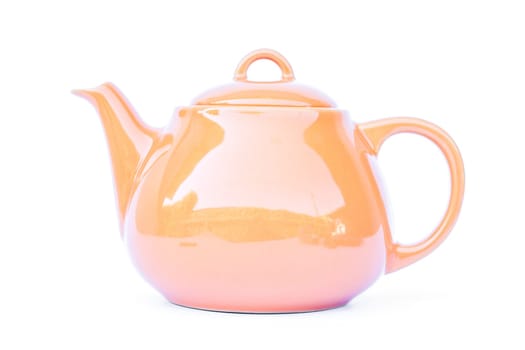 Orange ceramic teapot isolated on white background, stock photo