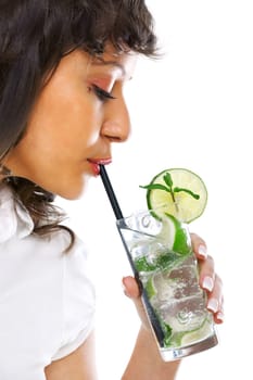 Young woman drinking mojito on white background