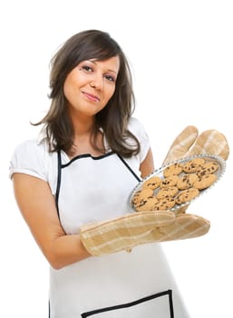 Young woman holding a tray with homemade chocolate cookies, looking at camera