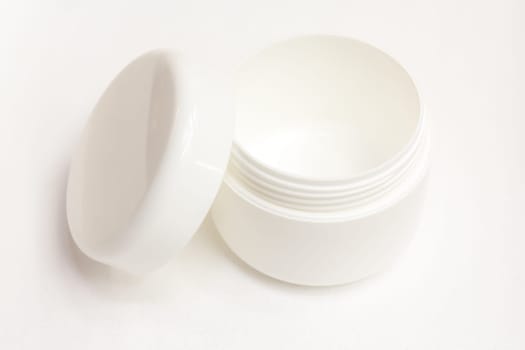 A cream can insulated against a white background