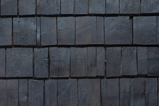 A dark,almost black wooden background