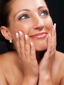 Young woman with make up isolated on black