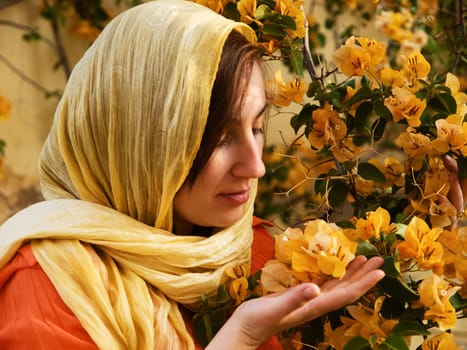 Young woman smelling flowers in Tunisia