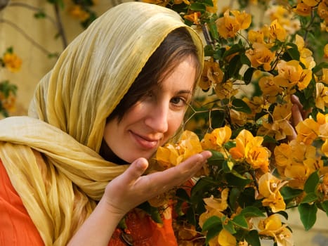 Young woman smelling flowers in Tunisia