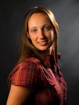 Young woman posing on black background