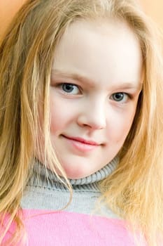 Portrait of cute girl with blond hair