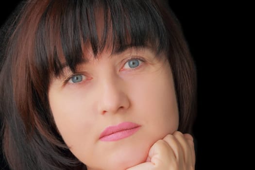 Portrait of woman with blue eyes and black hair