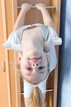 Photo of cute girl on gymnastic stairway