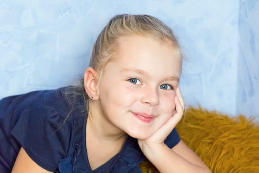Portrait of cute girl with blond hair