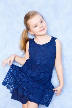 Portrait of cute girl with blond hair