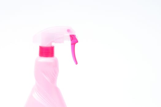 Pink plastic foggy spray bottle isolated on white background, stock photo