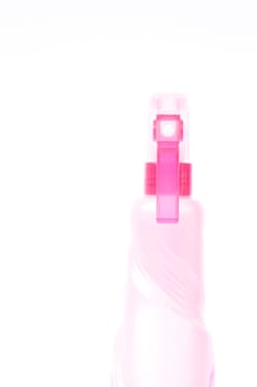 Pink plastic foggy spray bottle isolated on white background, stock photo