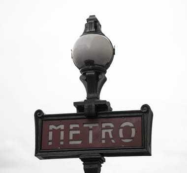 Ancient Metro Sign at the entrance of the Paris Metro