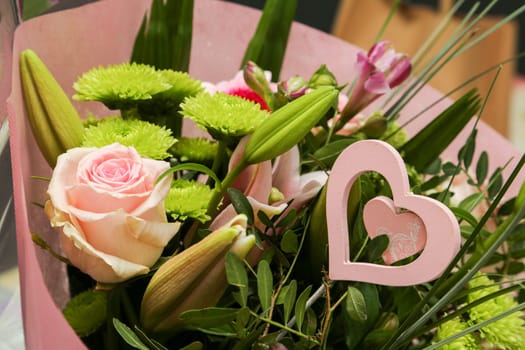 A beautiful flower bouquet with a romantic heart