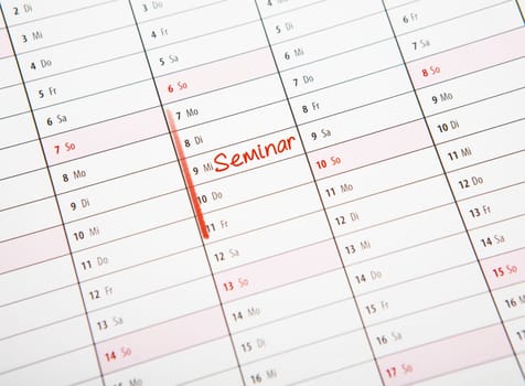 on a calendar an area for a seminar is marked in red